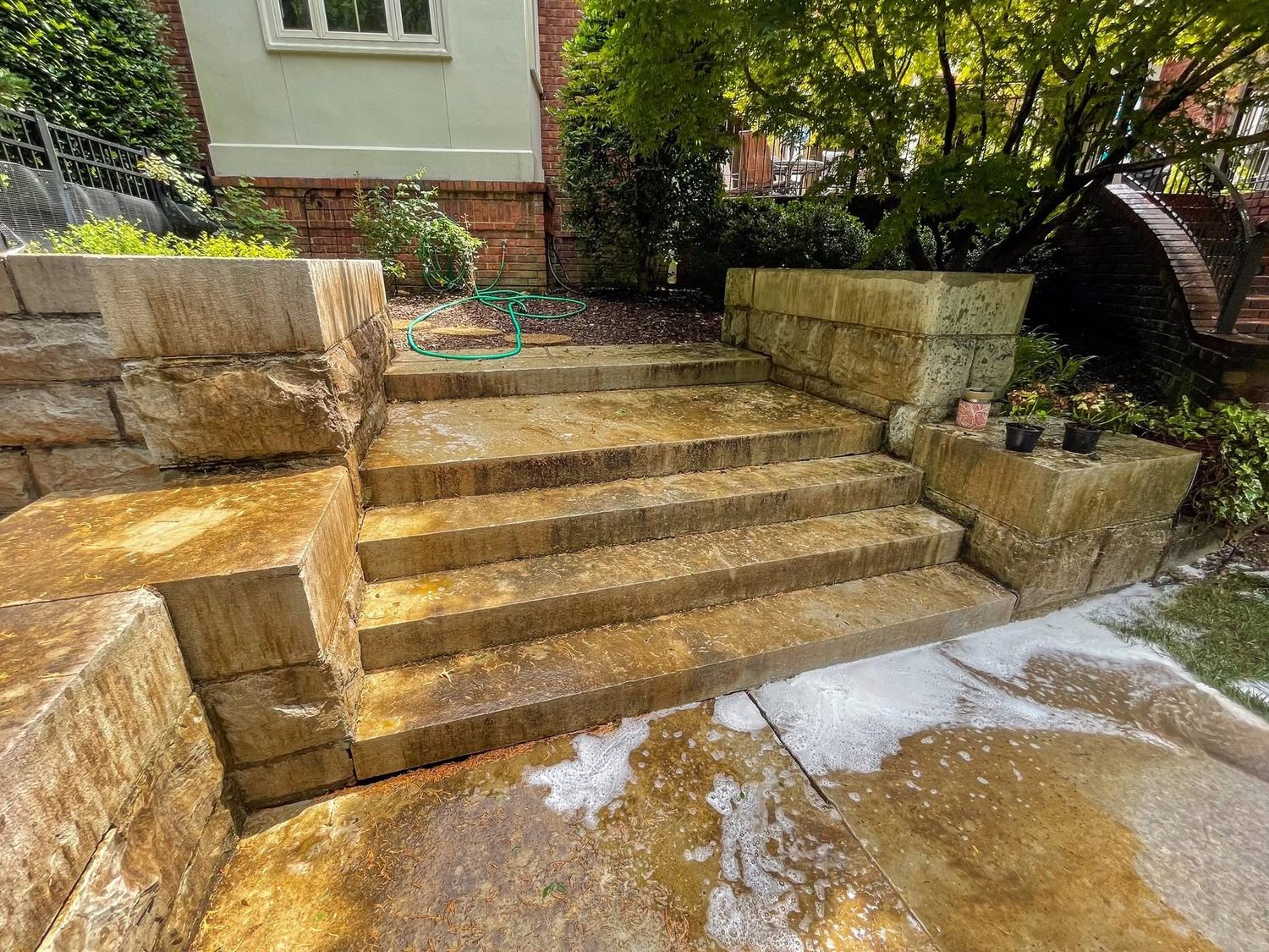 Concrete and stone steps stained orange before cleaning