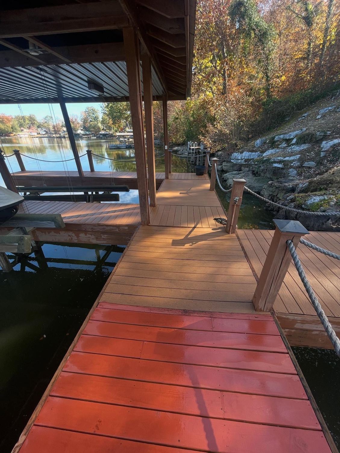 Freshly cleaned dock decking beside the water