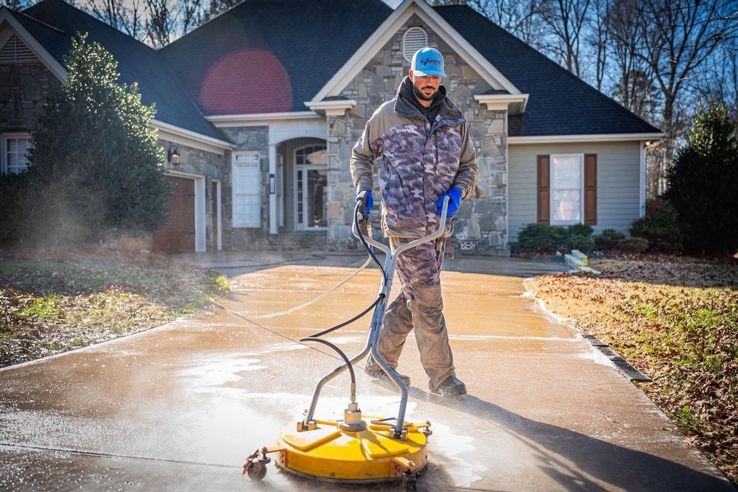 Surface cleaner being used on a residential driveway