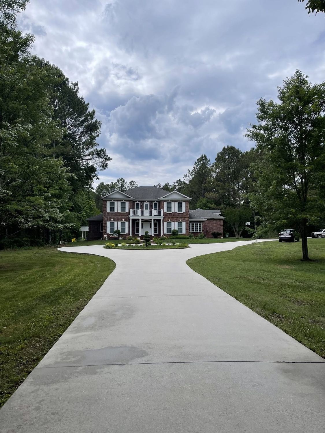 Clean residential driveway leading up to a home