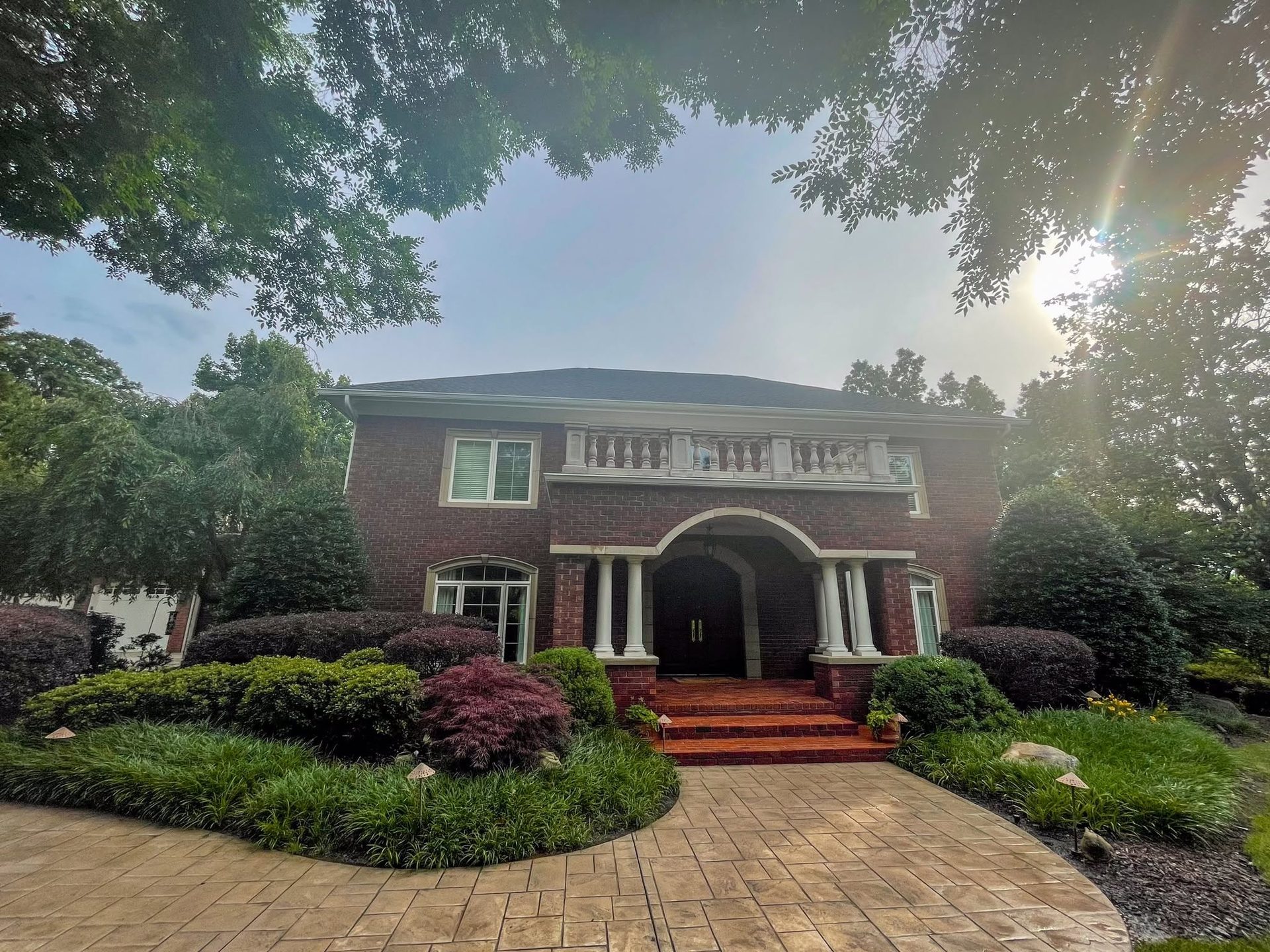 Brick home and paver driveway in the Chattanooga area after exterior cleaning