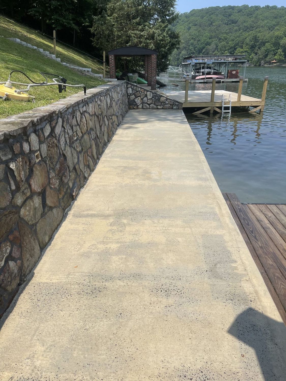 The same waterfront walkway and seawall after cleaning