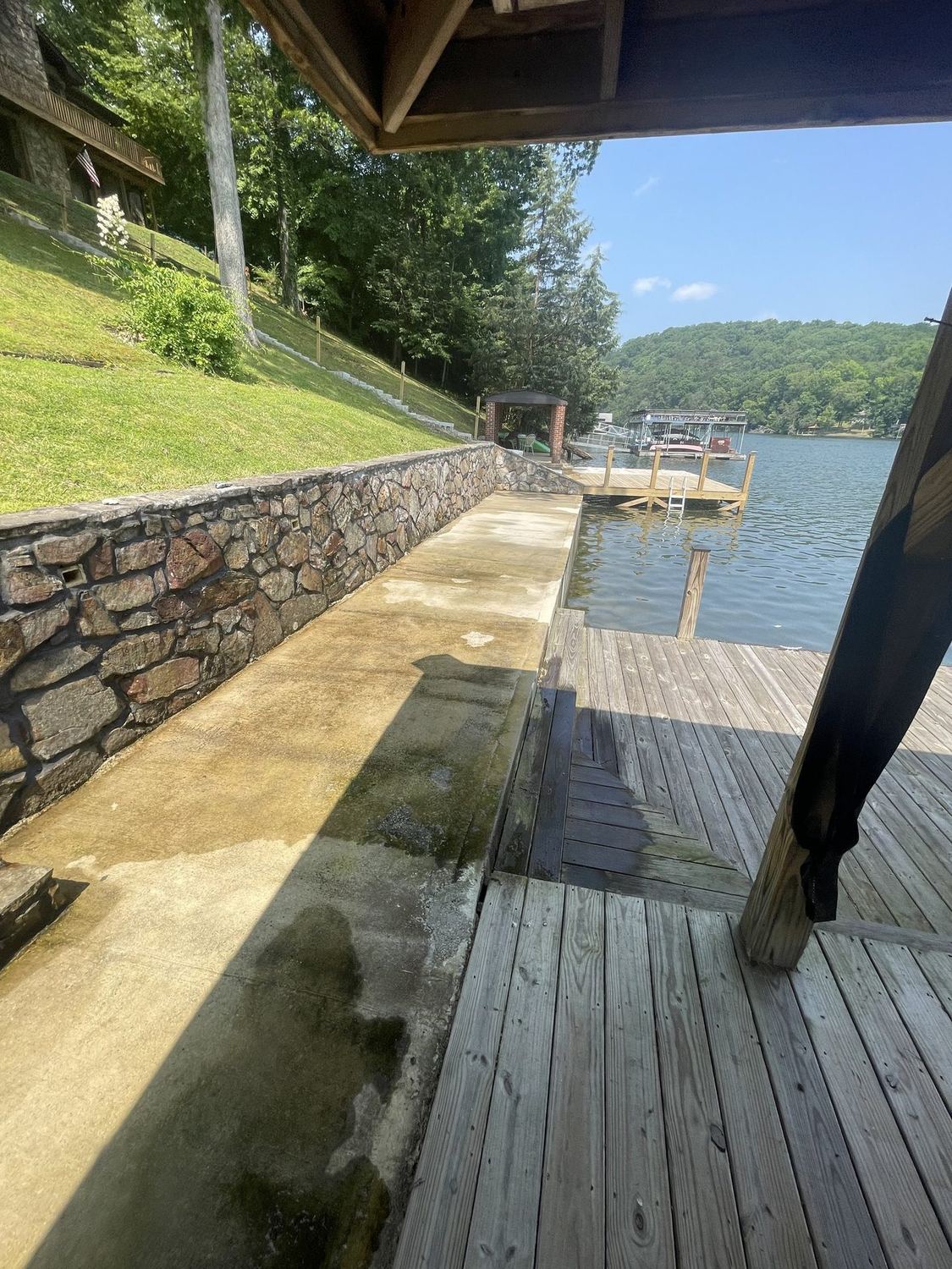 Waterfront walkway and seawall stained before cleaning